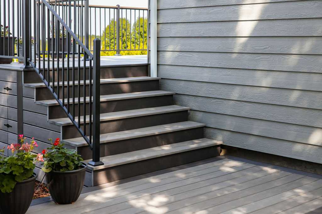 custom deck railing installation by Simpson Decks and Construction